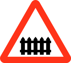 Warning for a railroad crossing with barriers.