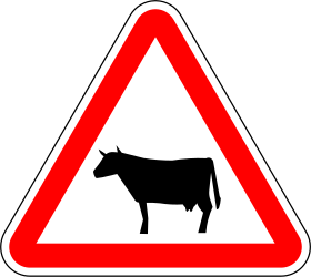 Advertencia para el ganado en la carretera.