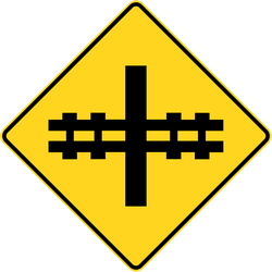 Advertencia por un  cruce de ferrocarril sin barreras.