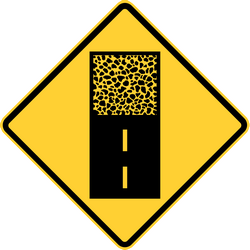 Warnung vor unbefestigter Fahrbahn.