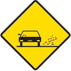Warnung vor losen Steinschlägen auf der Fahrbahn.