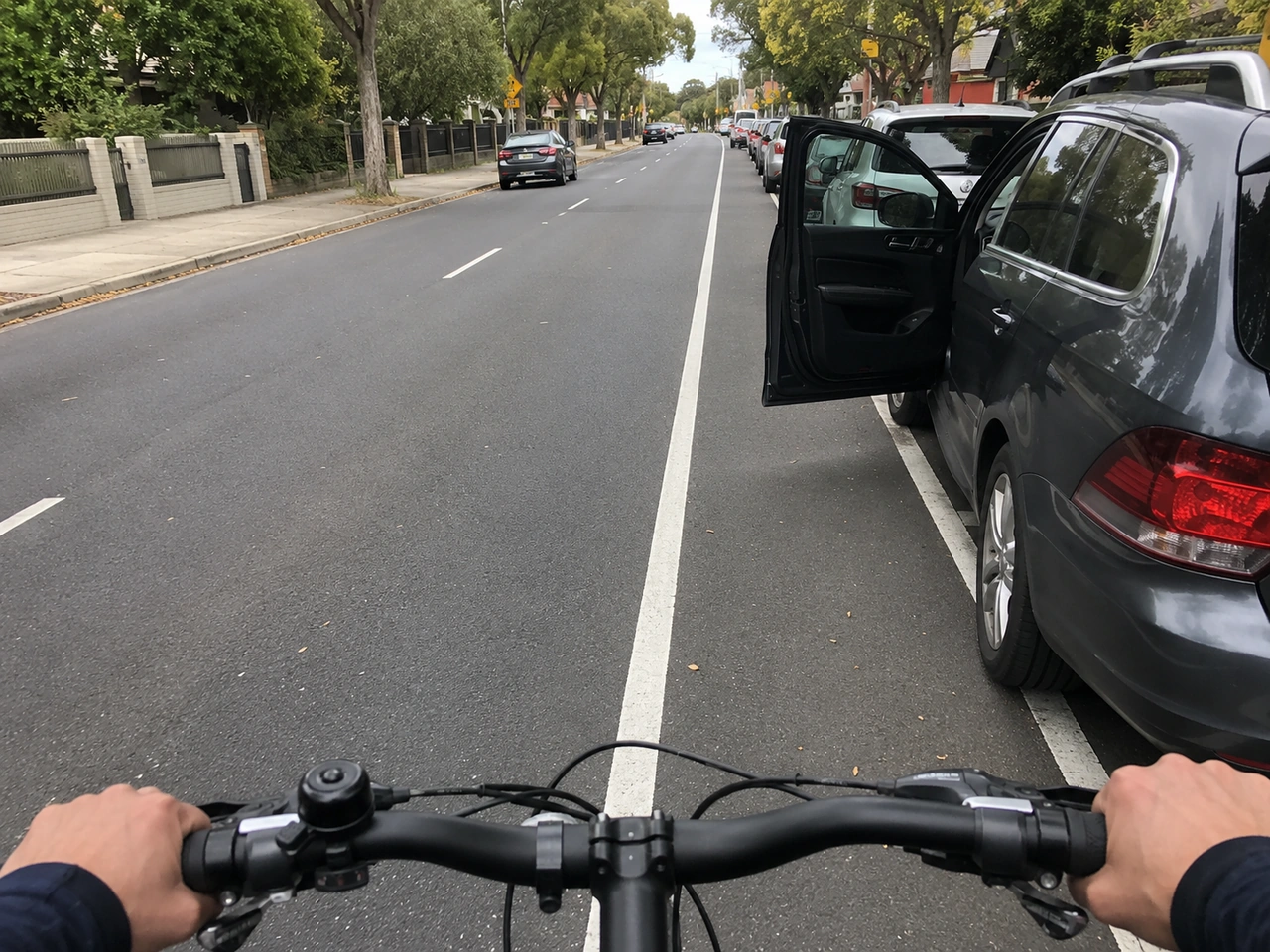 Why should you leave space when cycling beside parked cars?