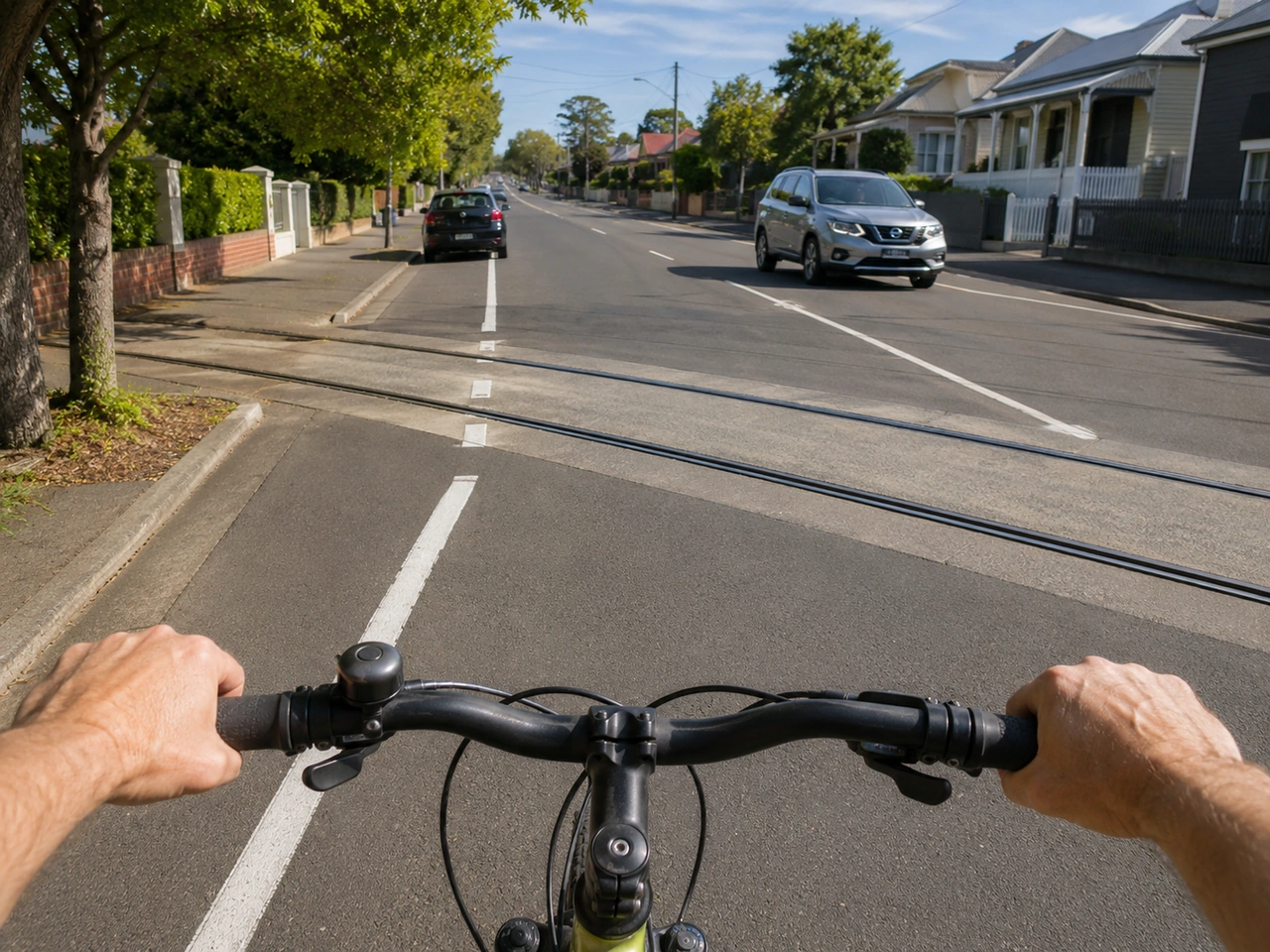 How should cyclists cross railway or tram tracks?