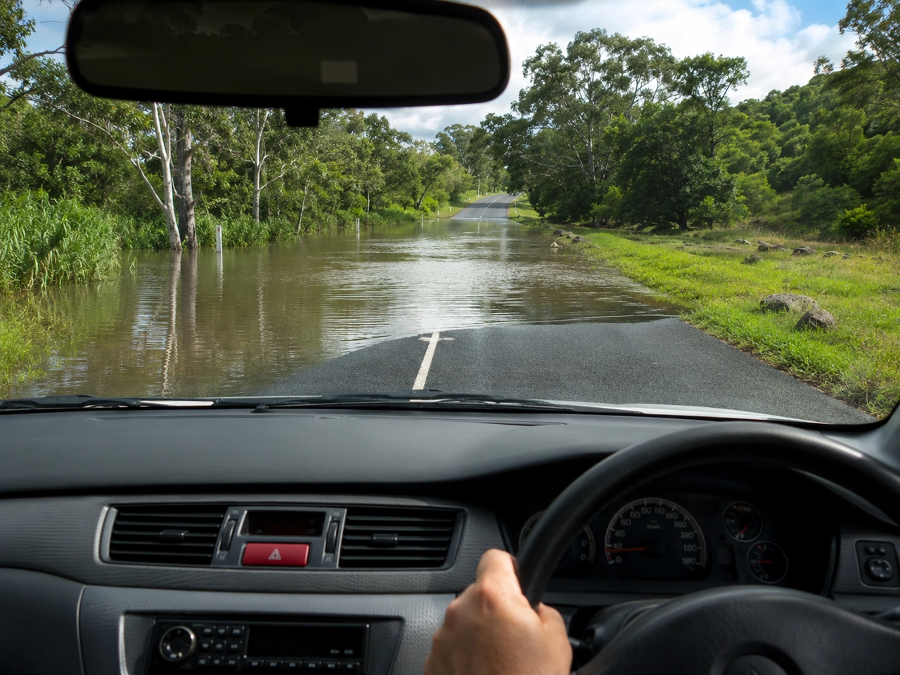 Why should you avoid driving through deep water?