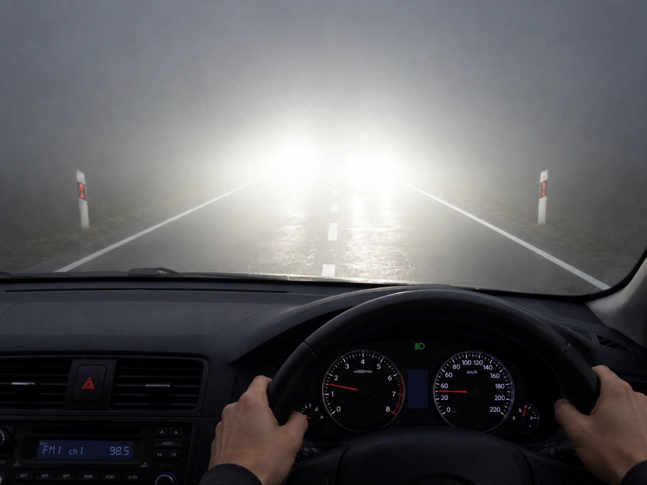 Why can main-beam headlights make driving in fog more difficult?