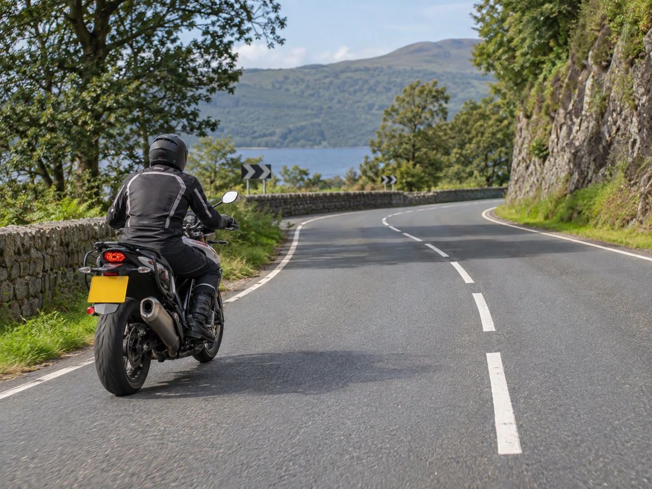 What should a motorcyclist do before entering a bend?