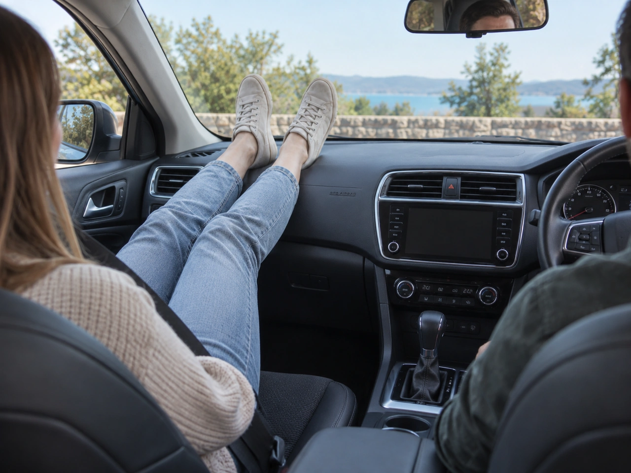 Why should a front passenger keep their feet off the dashboard?
