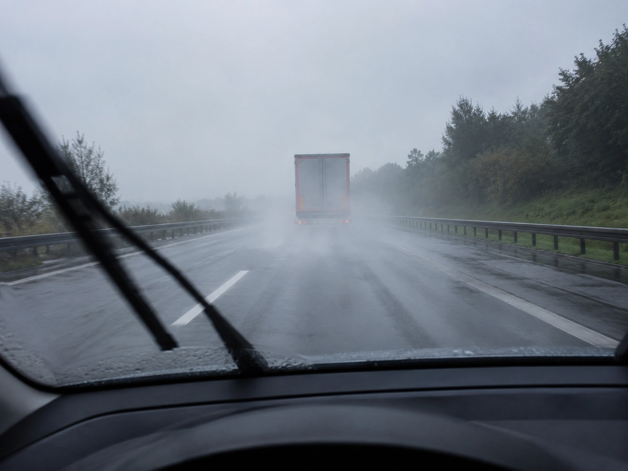 What should you do if spray from other vehicles makes it hard to see?
