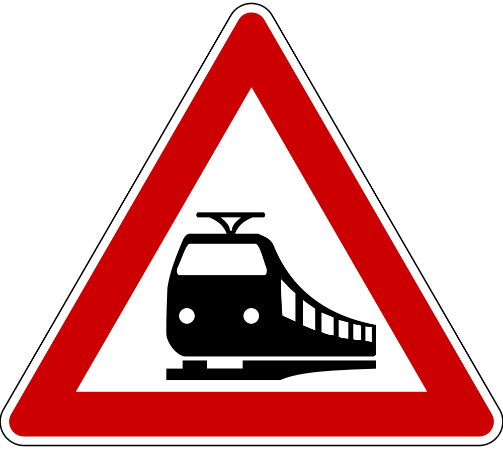 Waarschuwing voor een overweg zonder slagbomen.