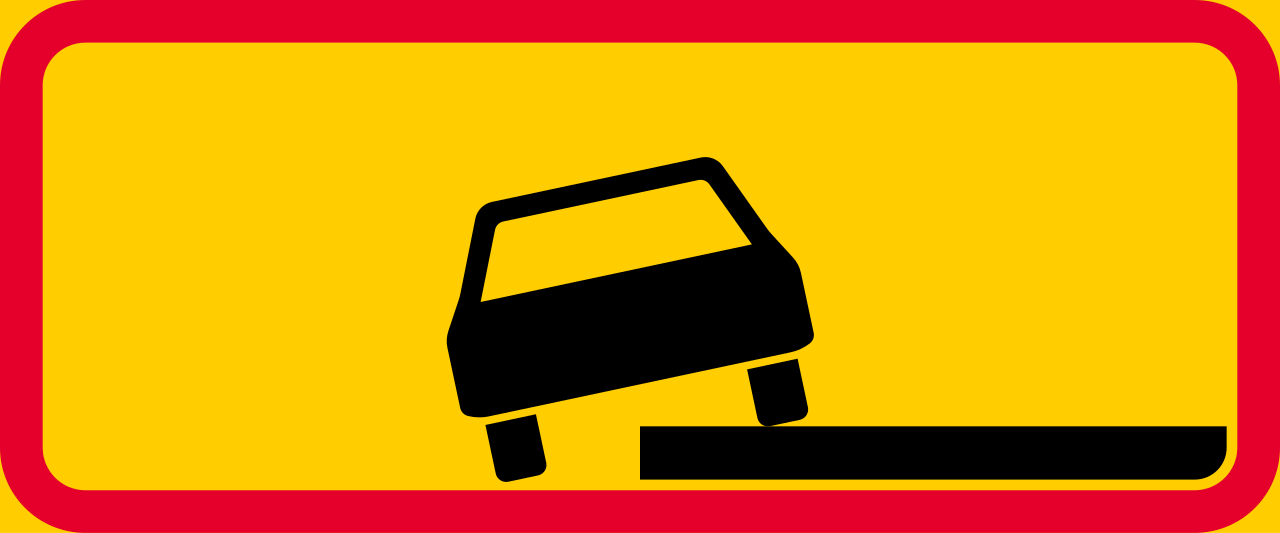 Parallel parking partially on pavement.